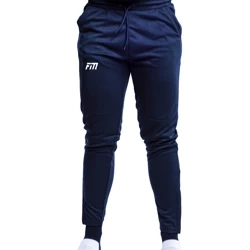 Zúžené tréningové nohavice - tmavomodré